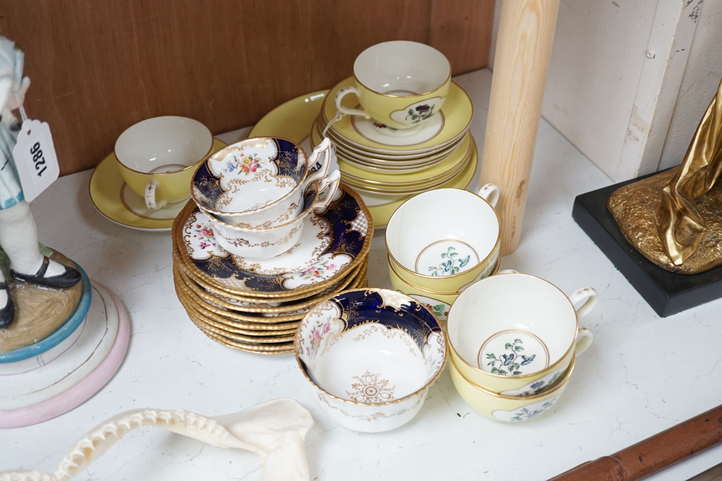 Royal Worcester for Aspreys - a set of six flower painted cups and saucers and four sideplates together with a Coalport part tea set